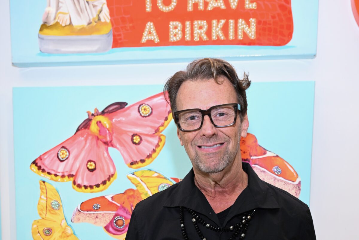 Don Purcell, owner of Don Purcell, in front of an Ashley Longshore piece of art
