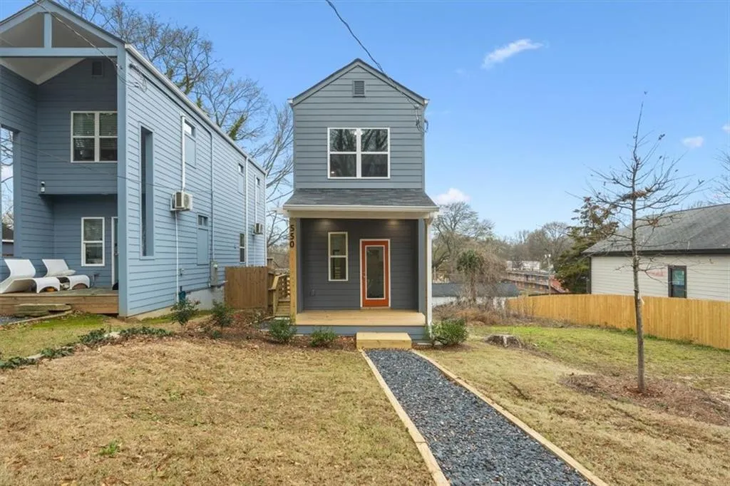 View of front of property with a front yard
