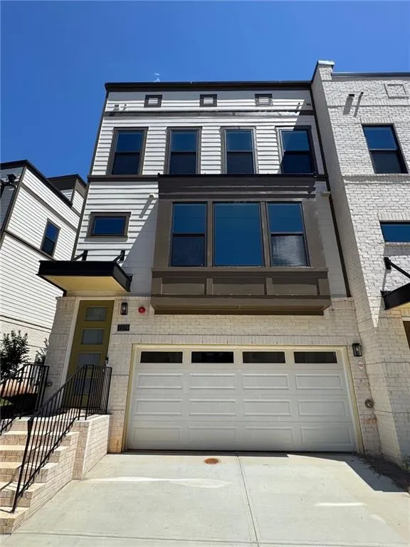 Stunning front elevation of this 4-story townhome