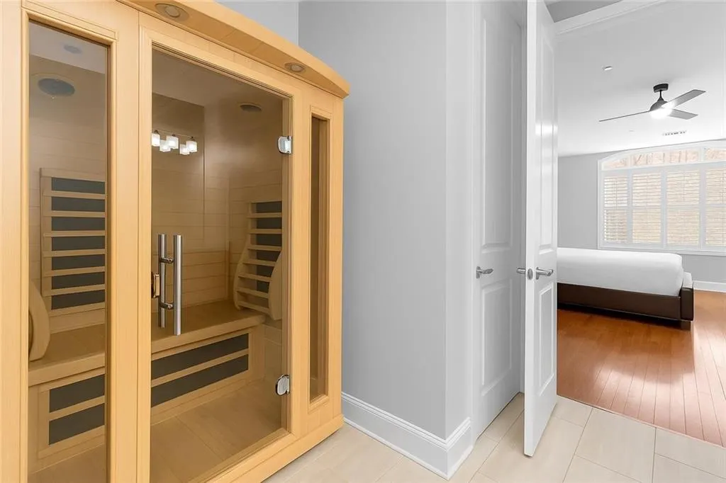 Newly installed sauna featuring elegant hardwood/wood style flooring for a warm, relaxing experience.
