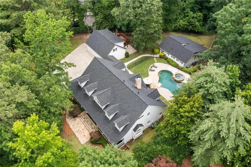 Traditional Buckhead home with walk-out yard and pool.