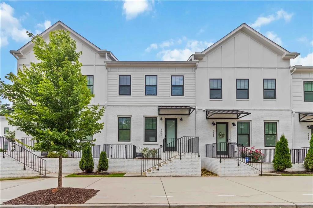 Multi unit property featuring brick siding and stairs