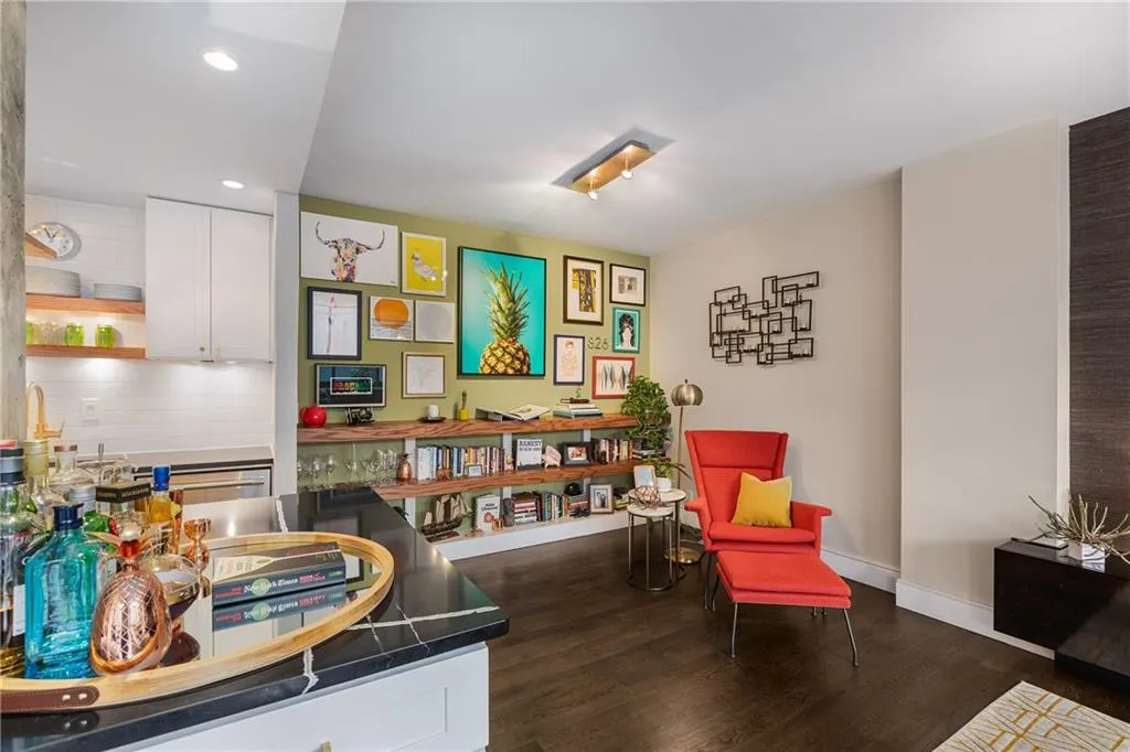 Sitting room featuring dark wood-style floors and recessed lighting