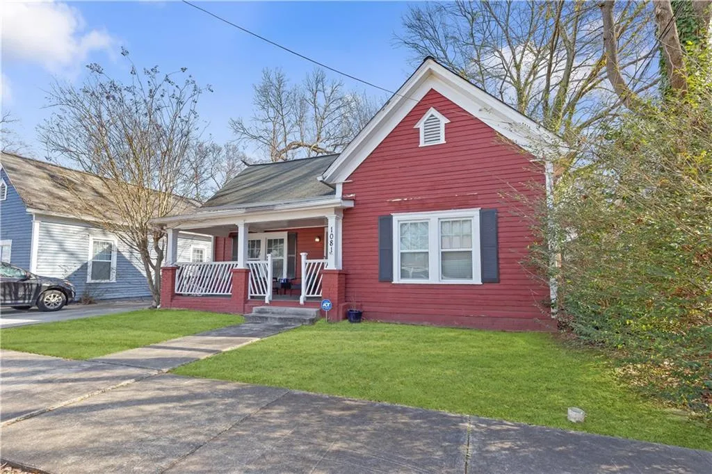 Bungalow-style home with a porch and a front yard