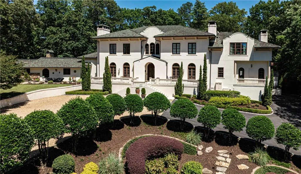 Exquisite Mediterranean estate home on nearly three private acres in Buckhead with spectacular pool and outdoor living space.