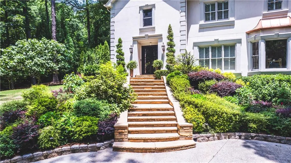 View of exterior entry featuring stucco siding